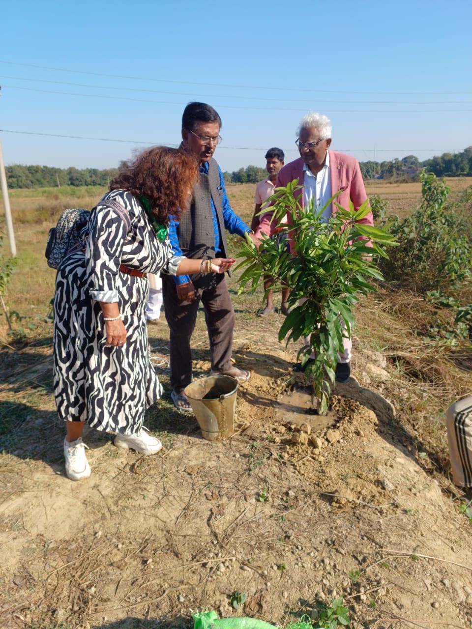 Prof. Choenni planting a mango sapling at Mithila Meadows