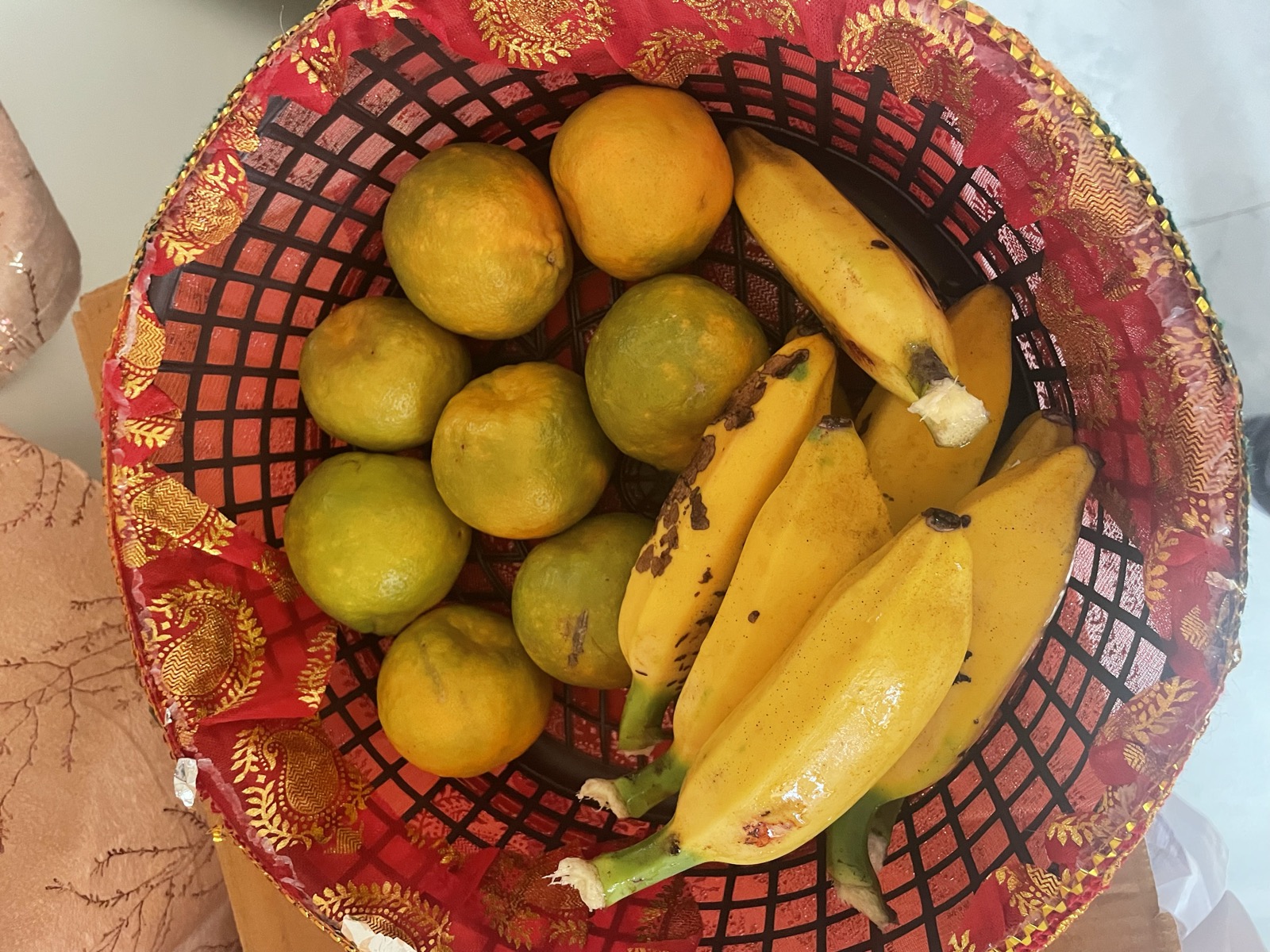 A basket of farm-fresh oranges and bananas